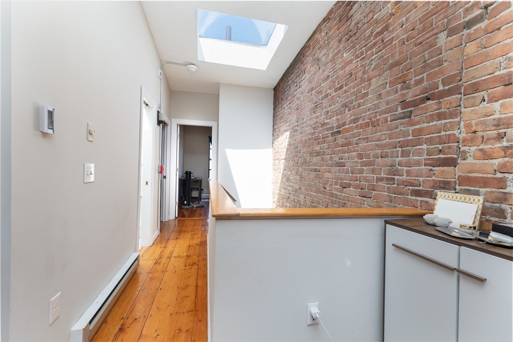 75 Chandler Street, Unit 7 Boston, MA 02116 - Photo 10 of 11 a hallway with a sink and cabinets
