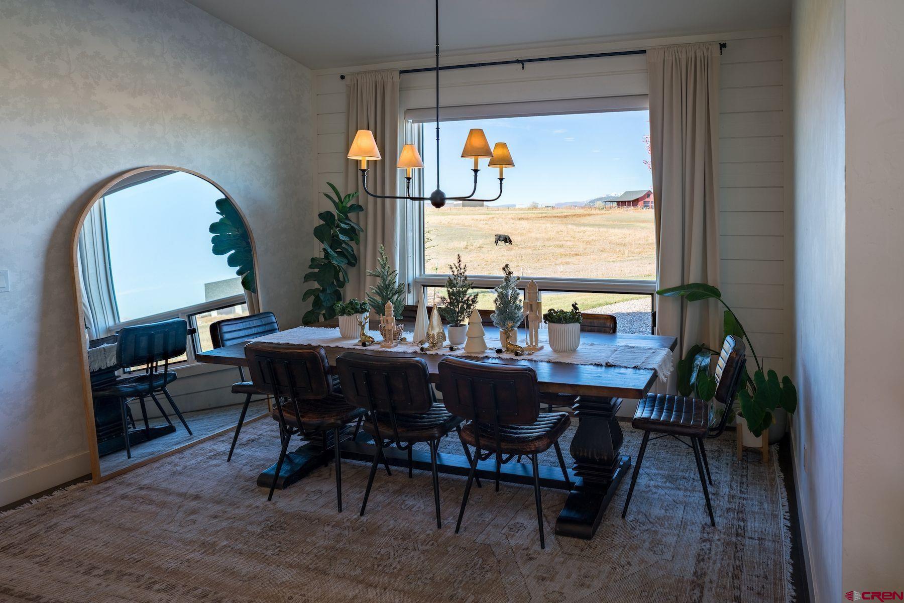 67 Range Road Durango, CO 81303 - Photo 11 of 34 a view of a dining room with furniture window and outside view