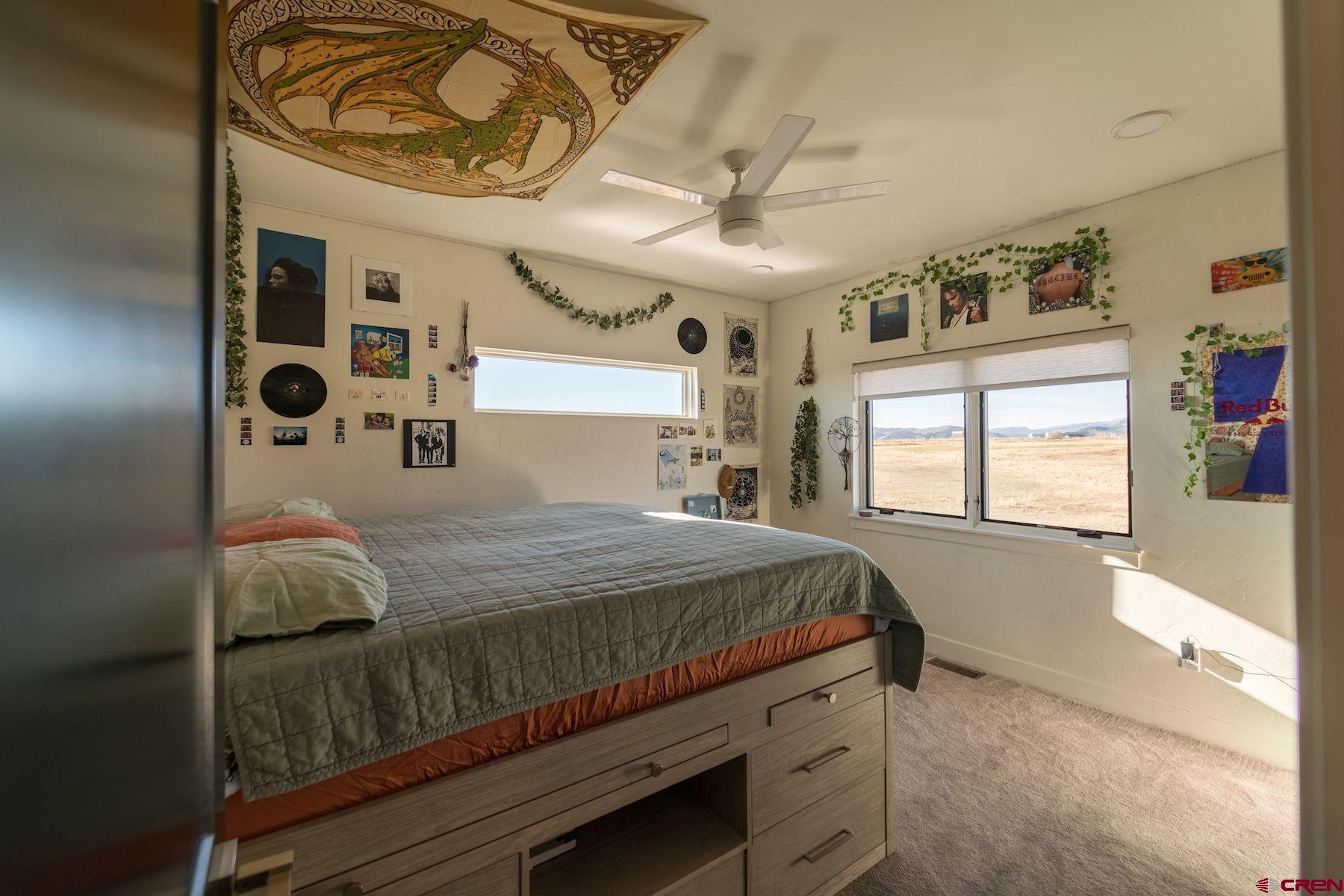 67 Range Road Durango, CO 81303 - Photo 23 of 34 a bedroom with a bed and window