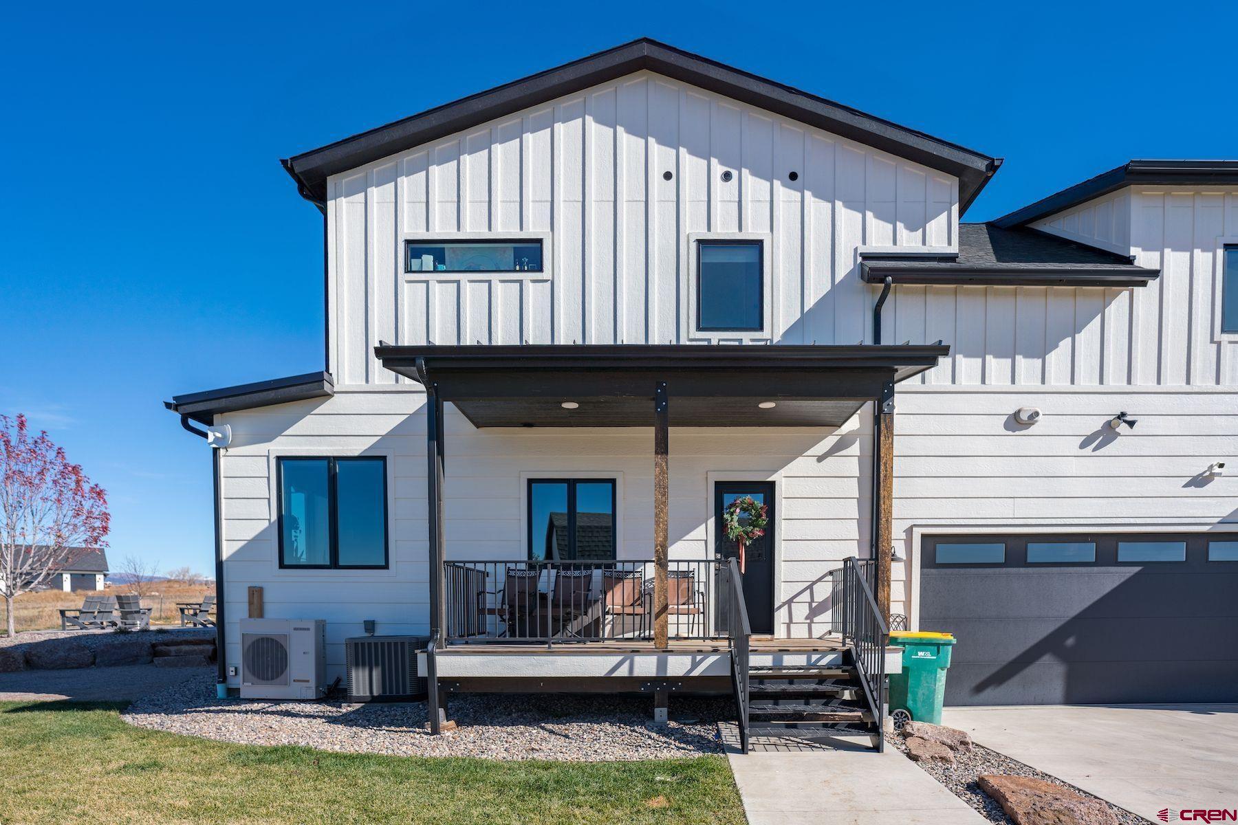 67 Range Road Durango, CO 81303 - Photo 28 of 34 a front view of a house with a yard