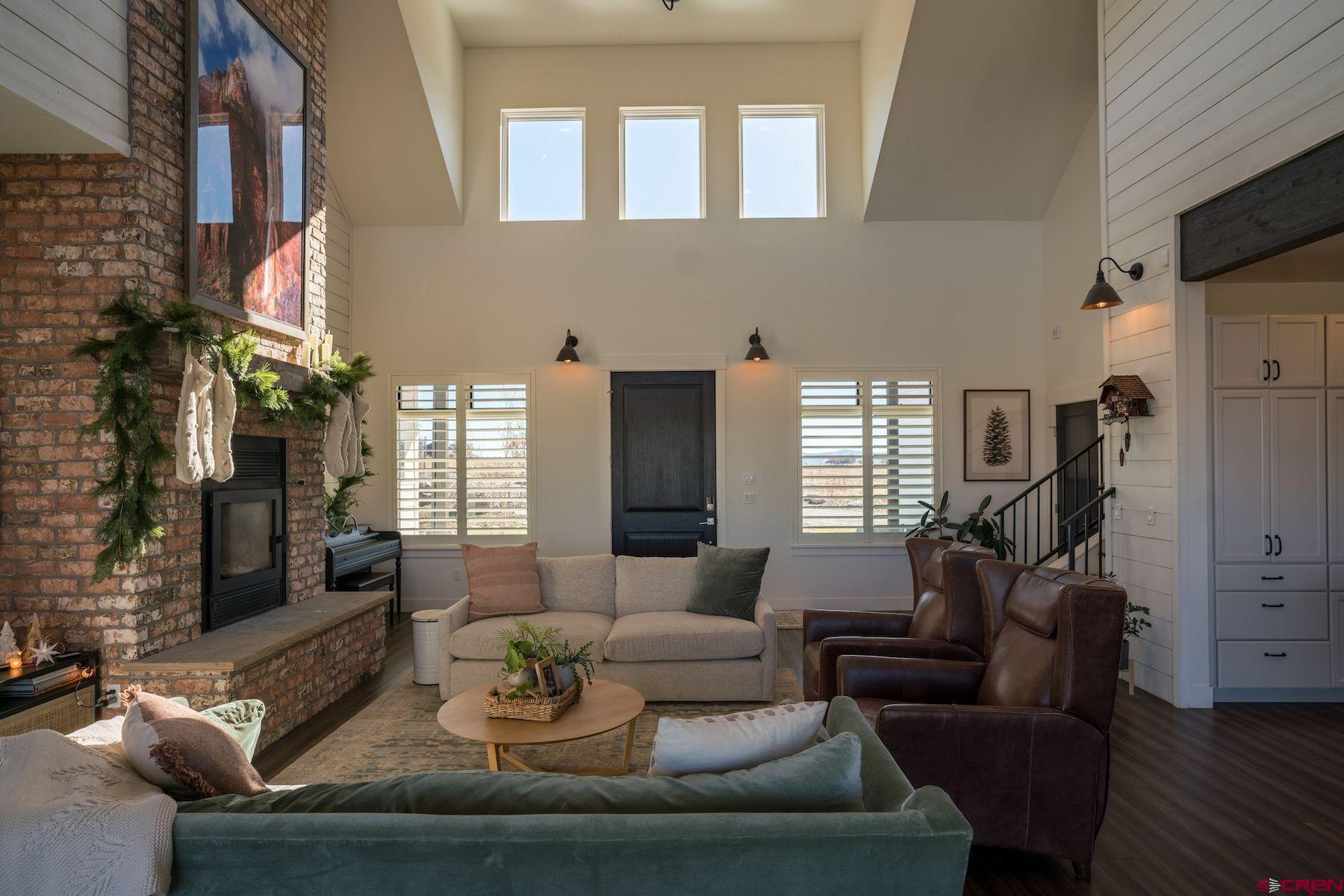 67 Range Road Durango, CO 81303 - Photo 6 of 34 a living room with furniture and a fireplace
