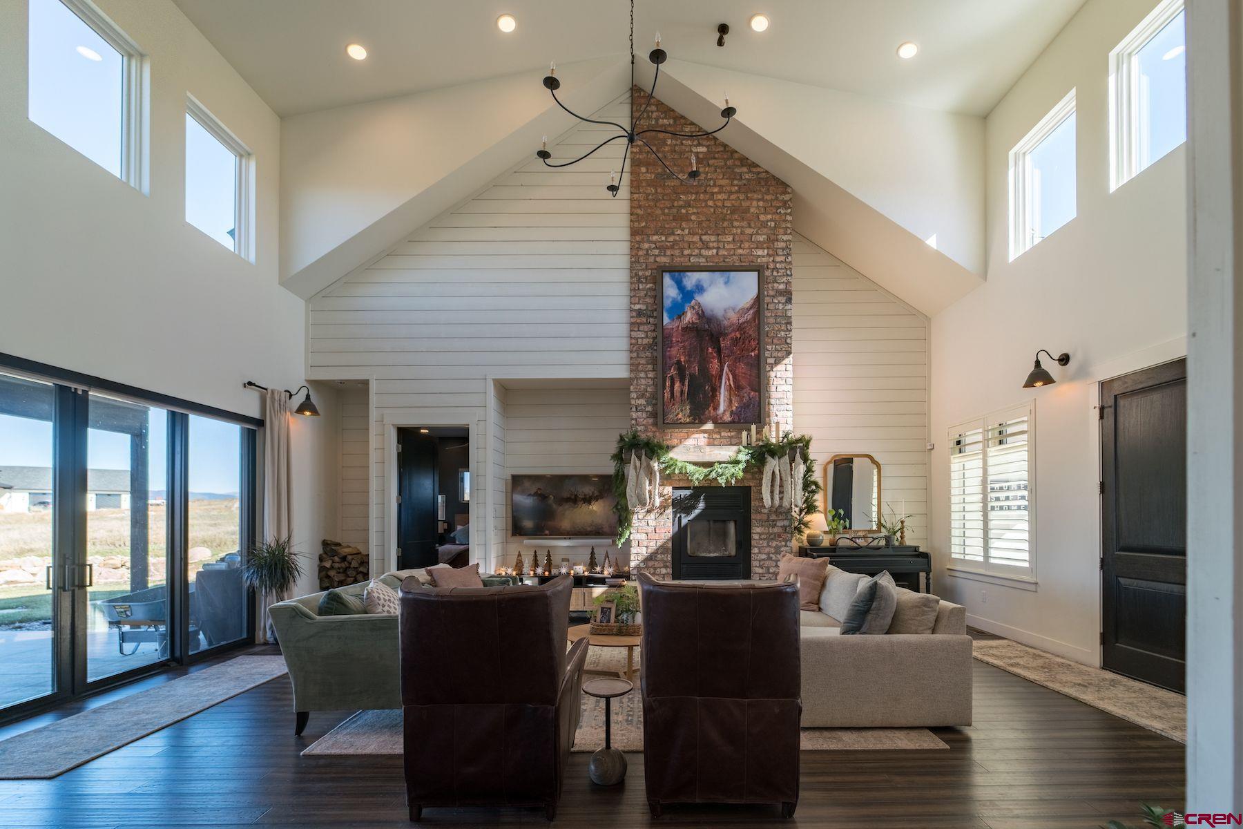 67 Range Road Durango, CO 81303 - Photo 7 of 34 a living room with furniture and wooden floor