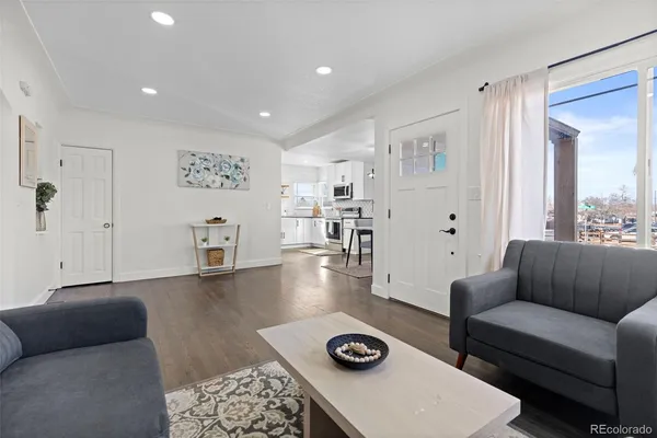 a living room with furniture and a table