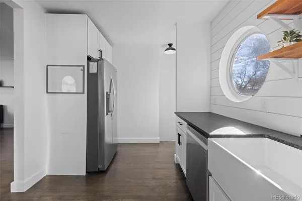 a view of a hallway with washer and dryer