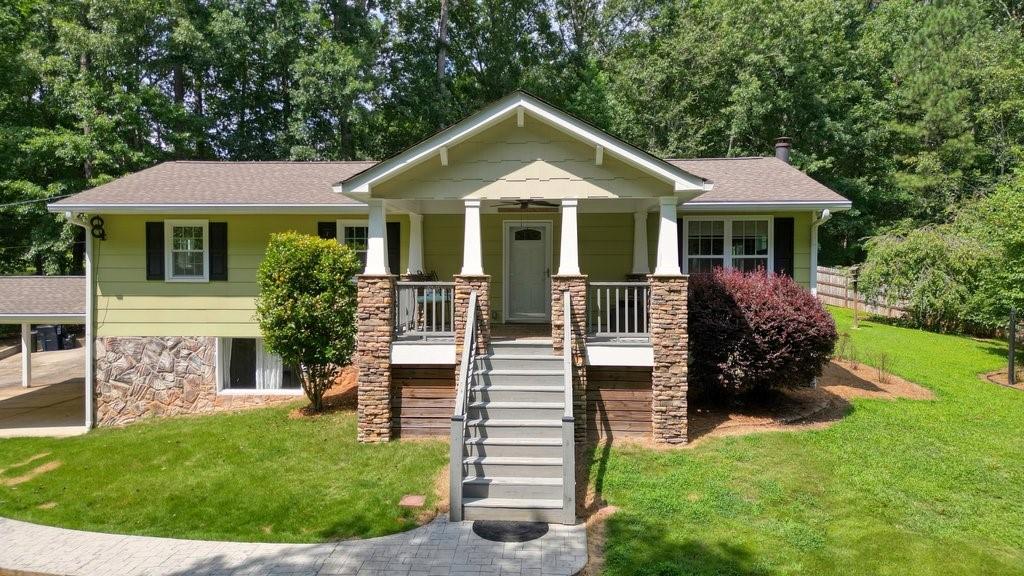 827 Stover Road Canton, GA 30115 - Photo 1 of 1 a front view of a house with a yard