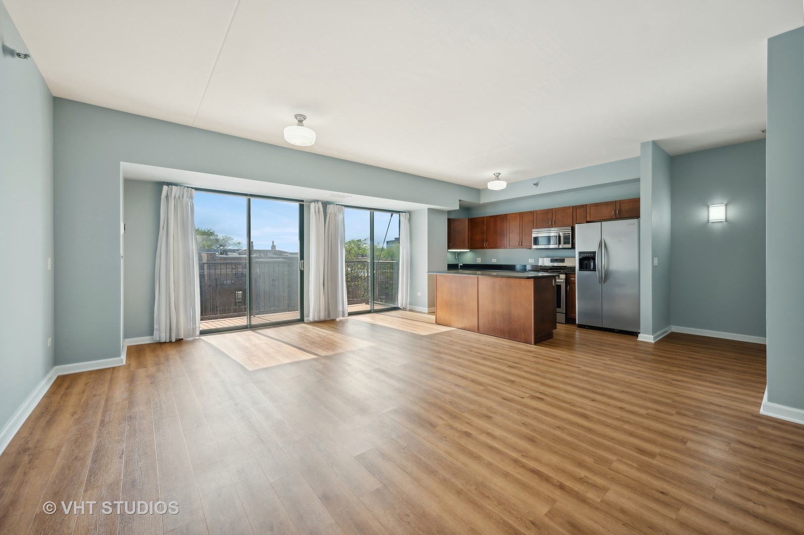 4848 North Sheridan Road, Unit 403 Chicago, IL 60640 - Photo 11 of 21 a view of a kitchen with a sink and a stove
