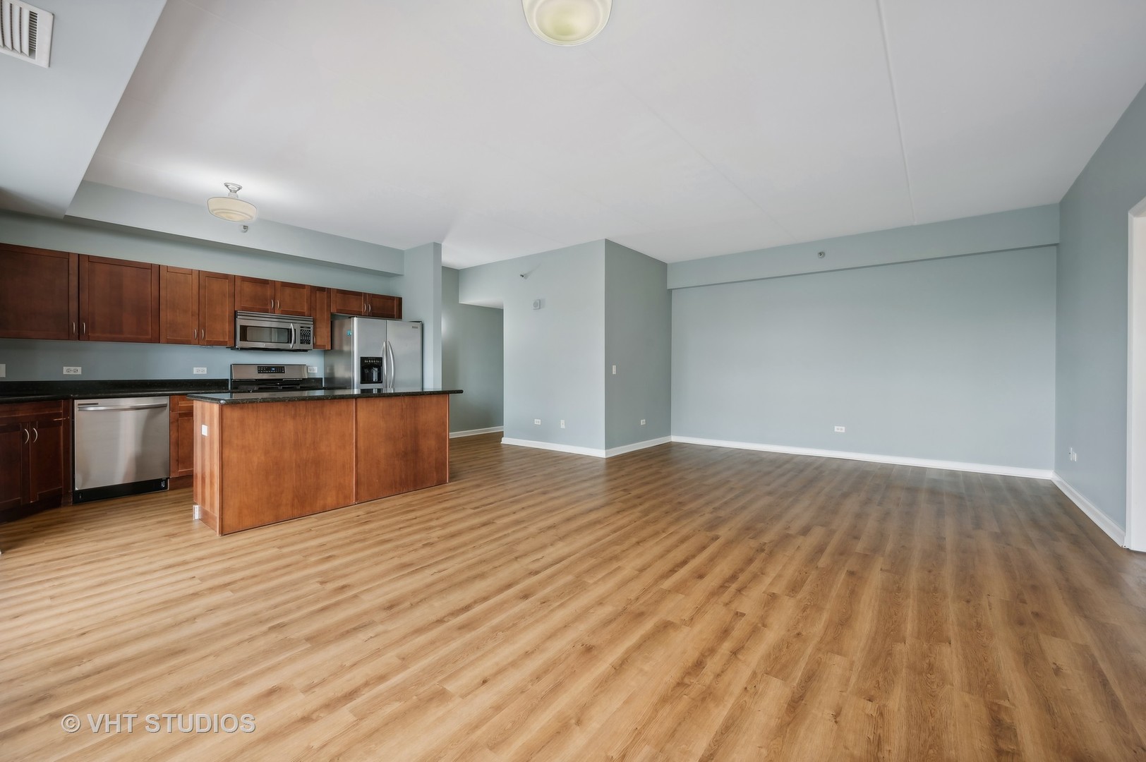4848 North Sheridan Road, Unit 403 Chicago, IL 60640 - Photo 12 of 21 a view of kitchen and wooden floor
