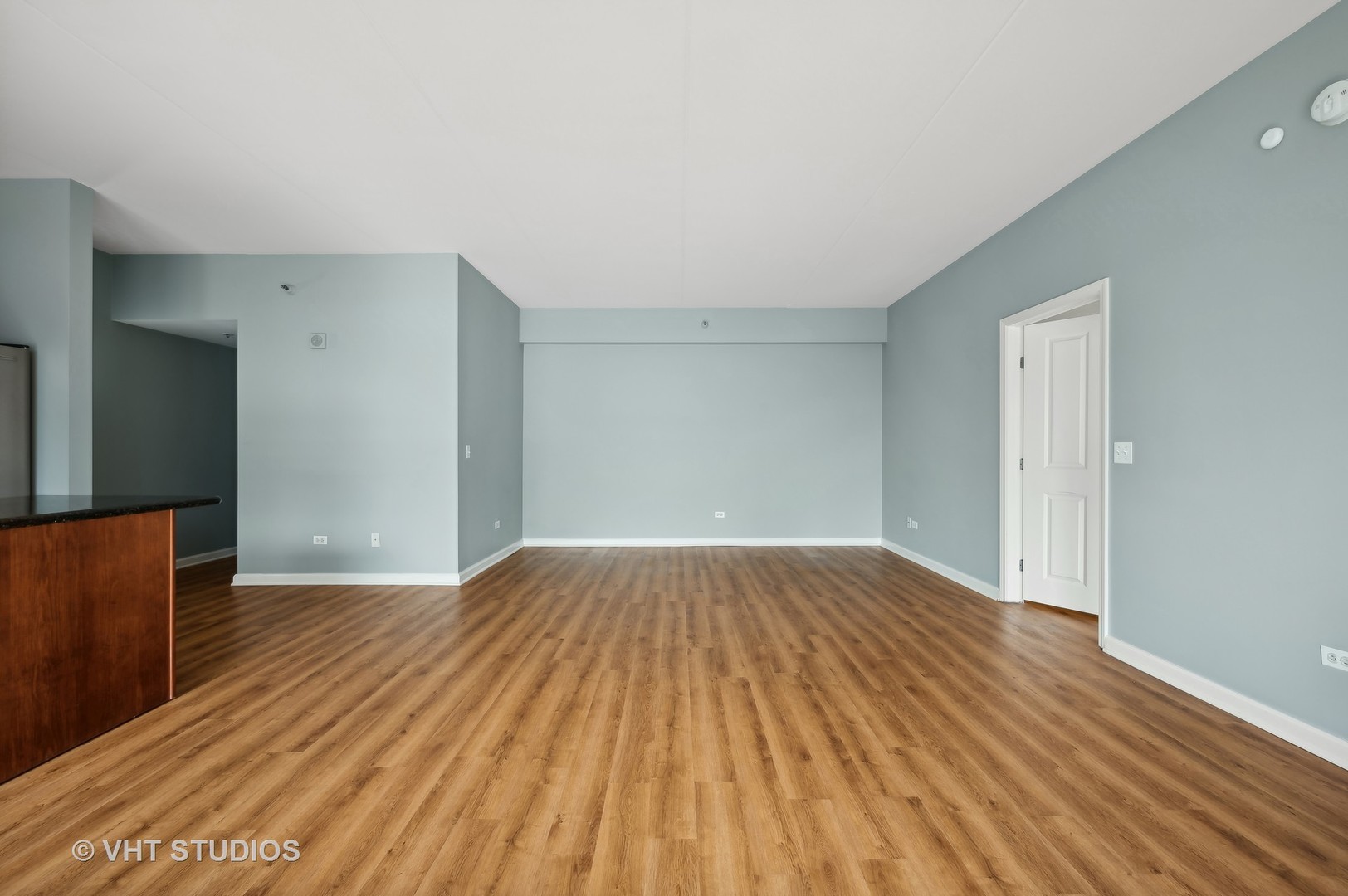 4848 North Sheridan Road, Unit 403 Chicago, IL 60640 - Photo 13 of 21 wooden floor in an empty room with a window