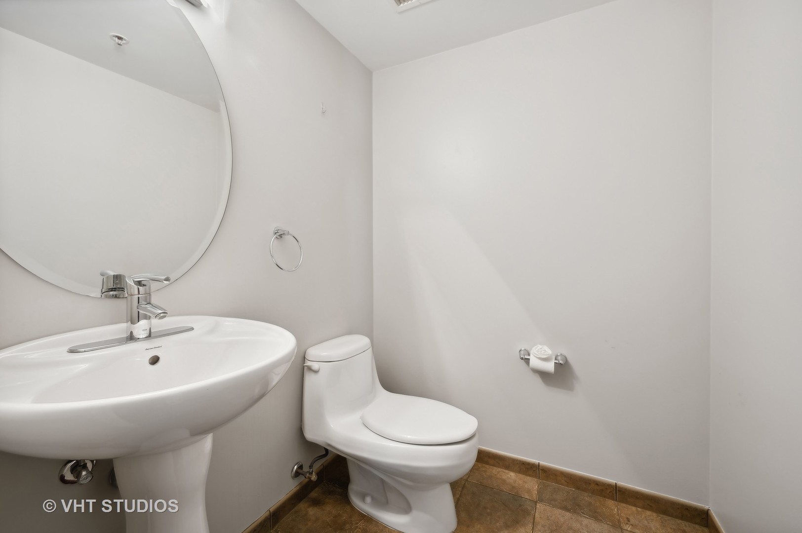 4848 North Sheridan Road, Unit 403 Chicago, IL 60640 - Photo 18 of 21 a white toilet sitting next to a bathroom sink