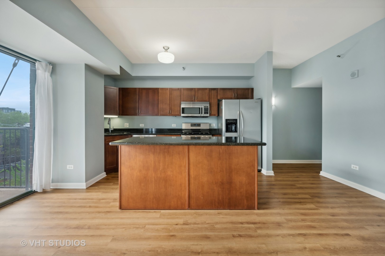 4848 North Sheridan Road, Unit 403 Chicago, IL 60640 - Photo 9 of 21 a kitchen with stainless steel appliances granite countertop a refrigerator and a stove top oven