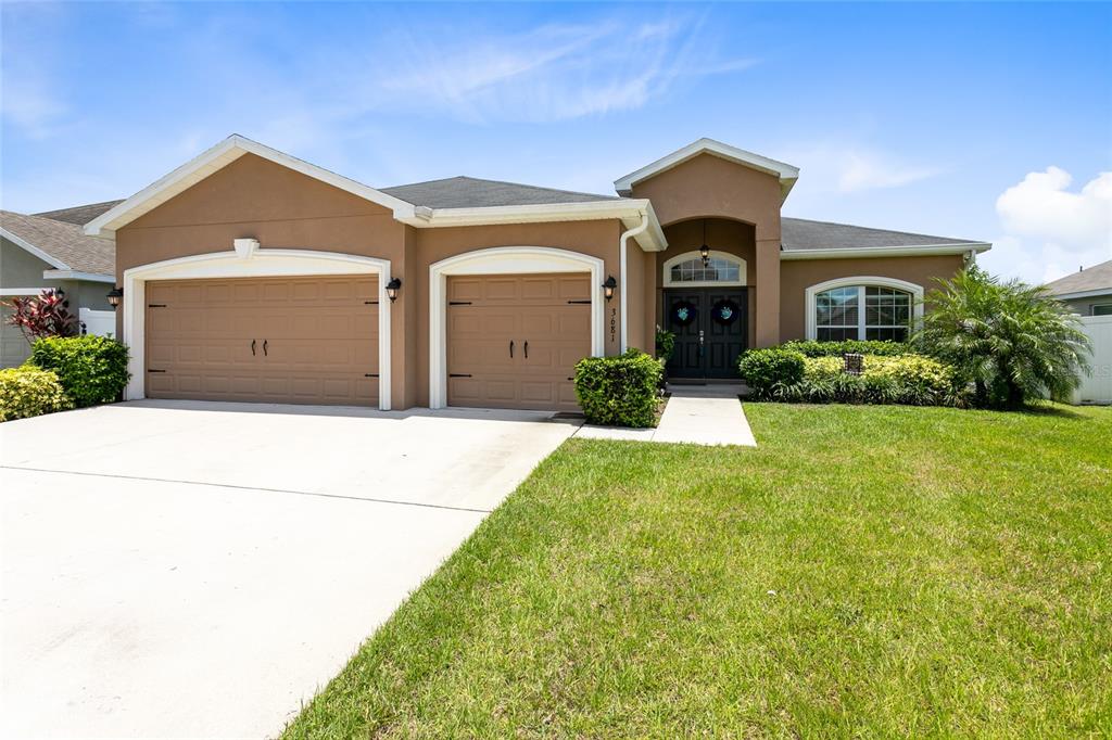 A beautifully landscaped front lawn welcomes you this STUNNING St. Cloud home!