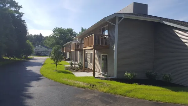 a view of the house with backyard and garden