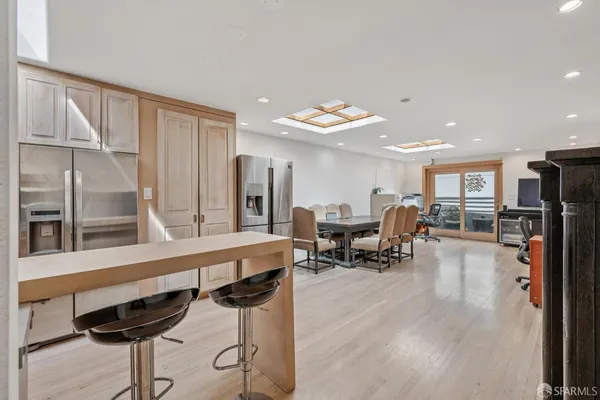a living room with furniture a table and chairs