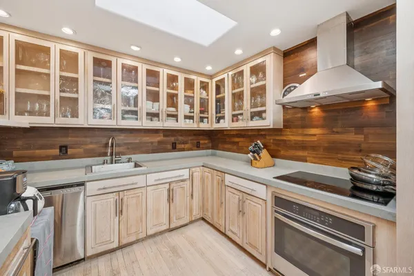 a kitchen with a sink and cabinets