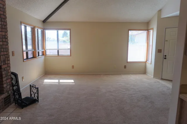 a view of empty room with windows