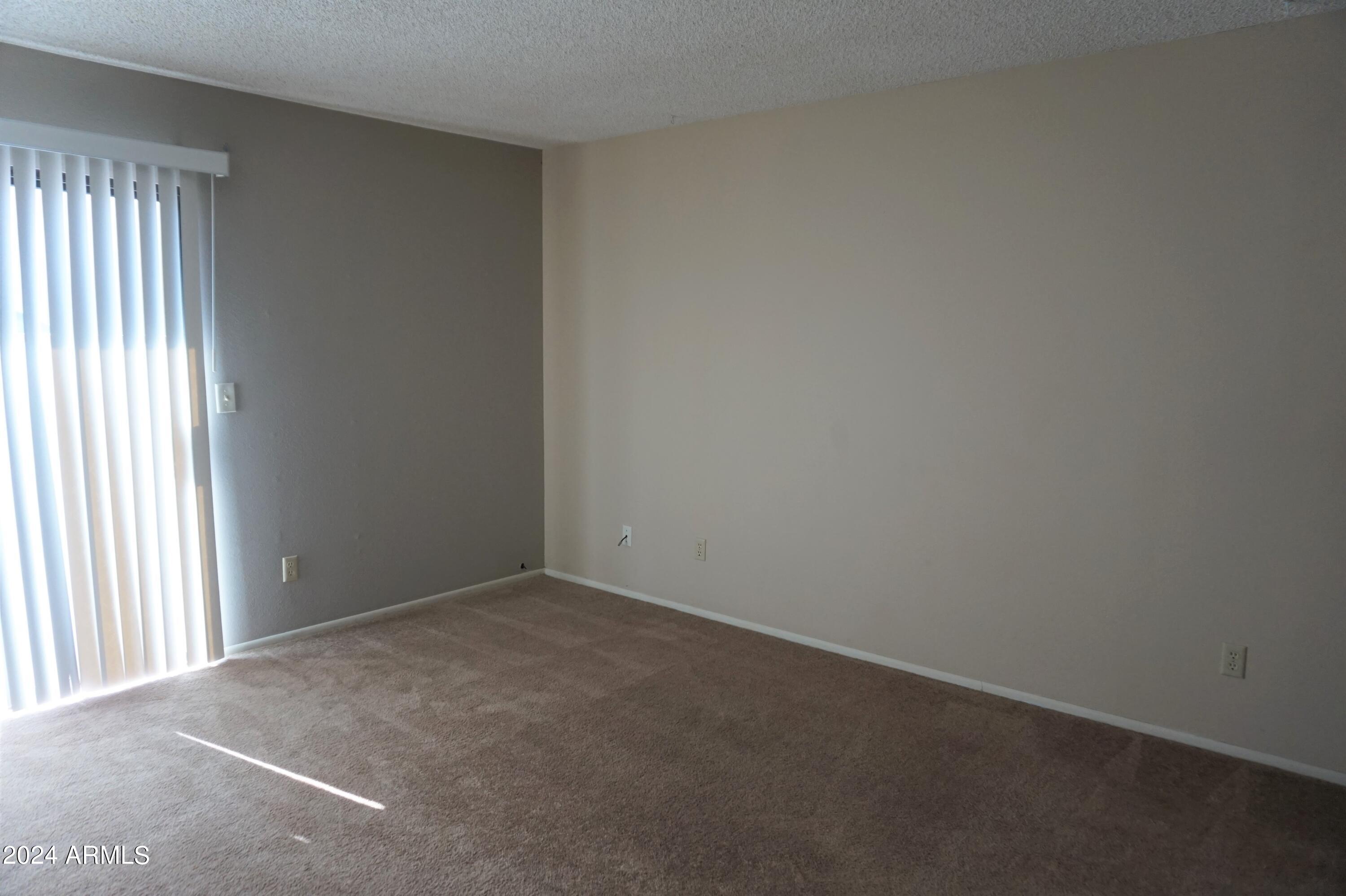 1762 Corte Encantada, Unit E Sierra Vista, AZ 85635 - Photo 6 of 10 an empty room with windows