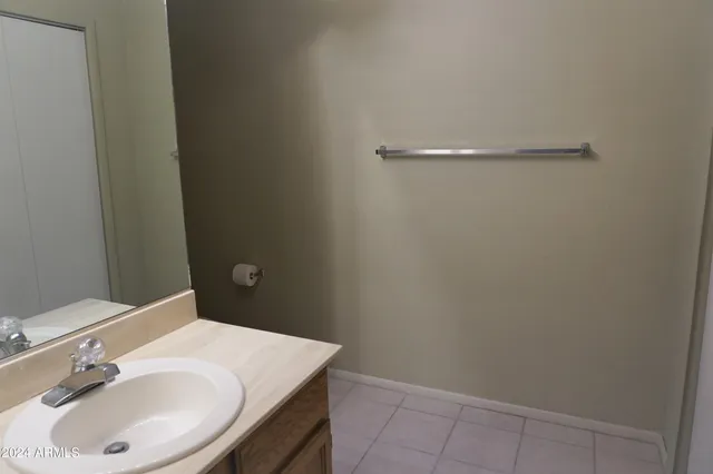 a bathroom with a sink and vanity