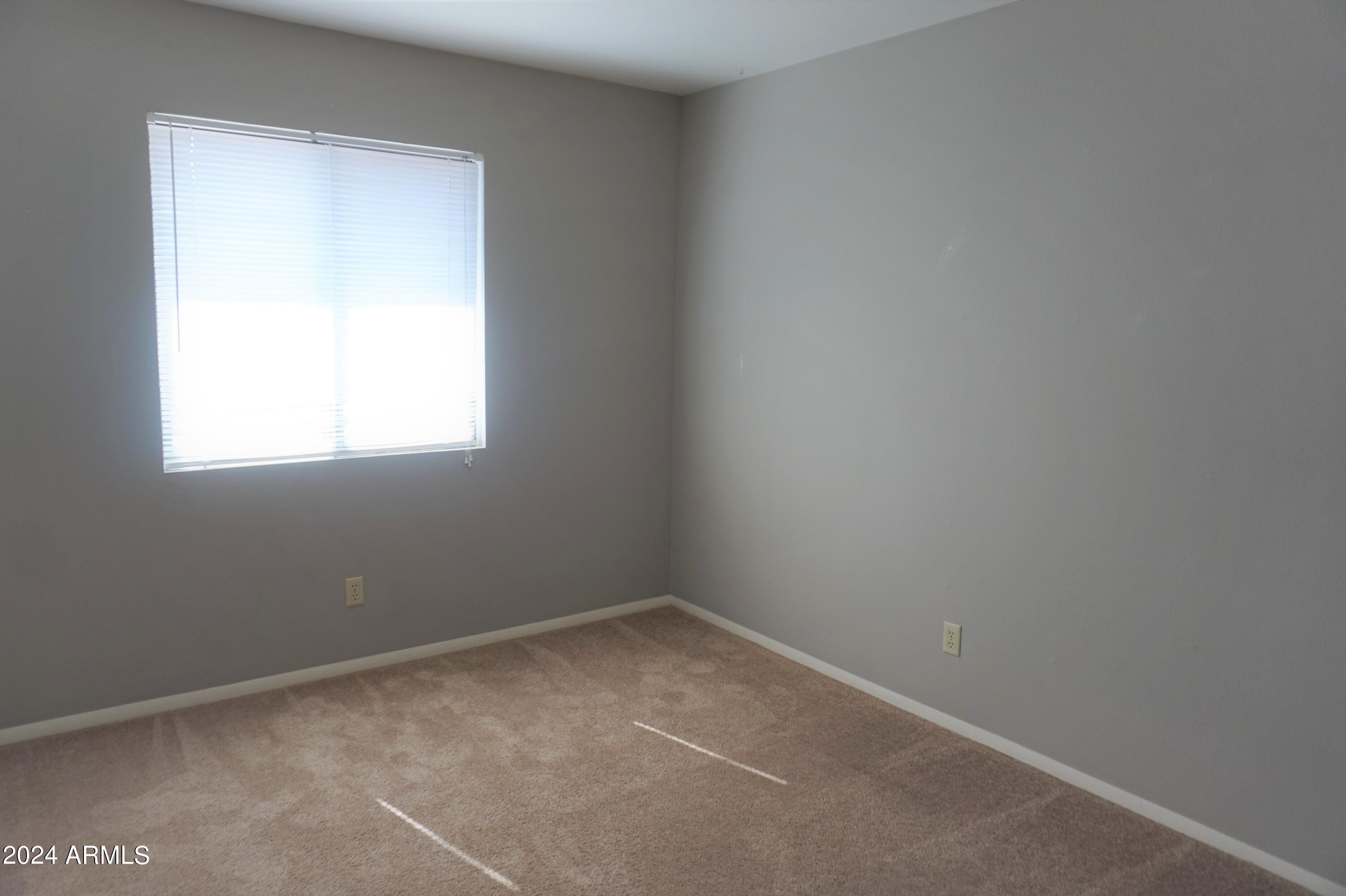 1762 Corte Encantada, Unit E Sierra Vista, AZ 85635 - Photo 8 of 10 an empty room with a window