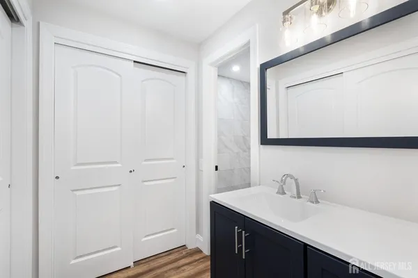 a bathroom with a sink and a mirror