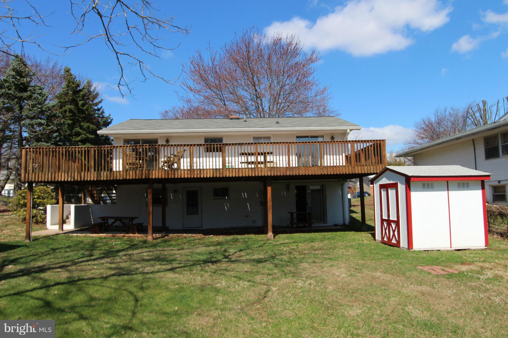 1010 South Hoga Road Sterling, VA 20164 - Photo 3 of 20 a front view of a house with a garden