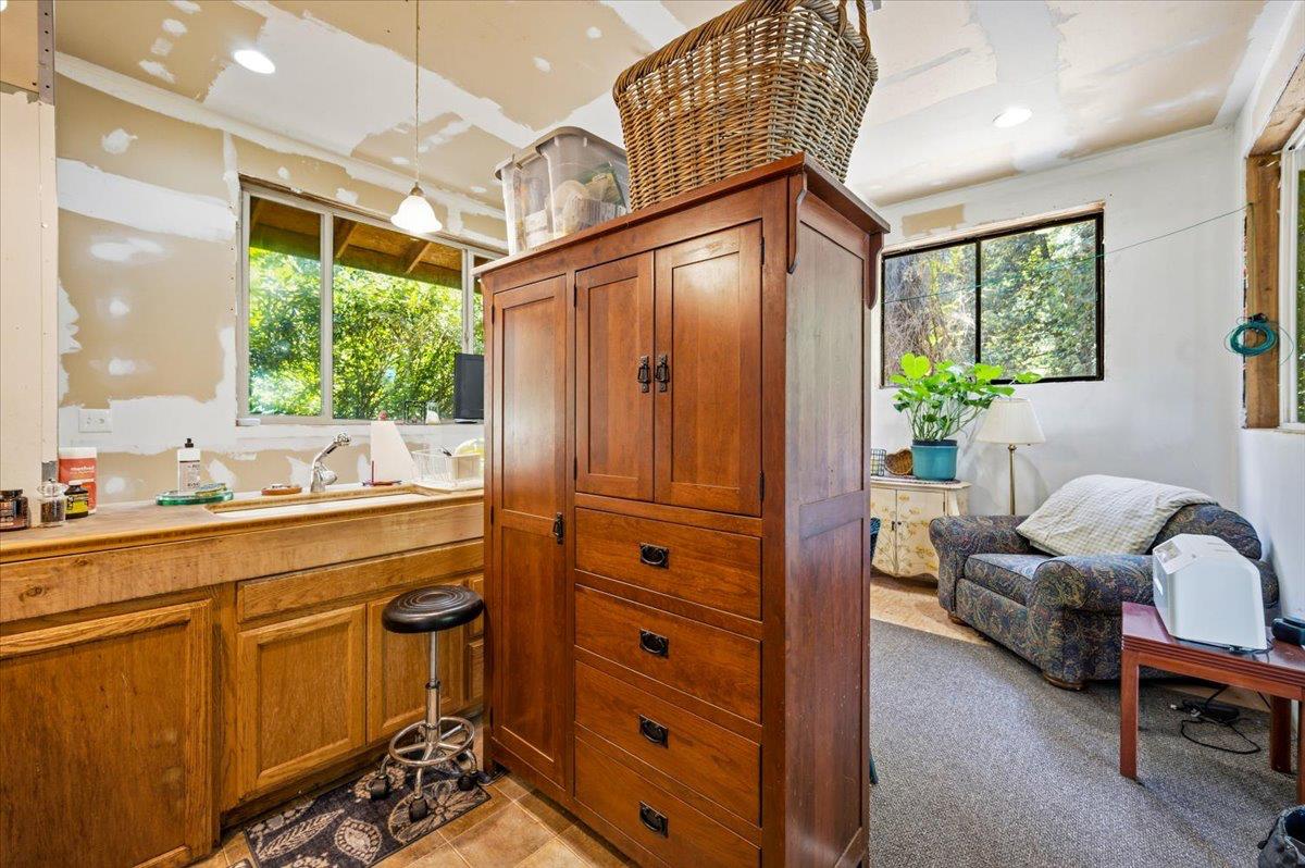 19643 Sages Road Nevada City, CA 95959 - Photo 12 of 39 a spacious bathroom with a granite countertop sink and a window