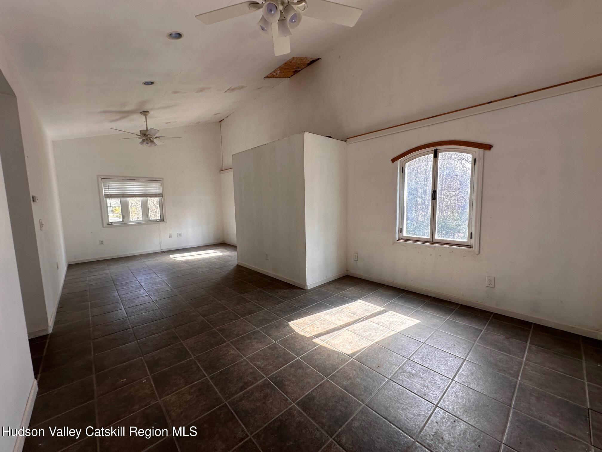 6 Riverbend Road Saugerties, NY 12477 - Photo 4 of 16 a view of an empty room with a window