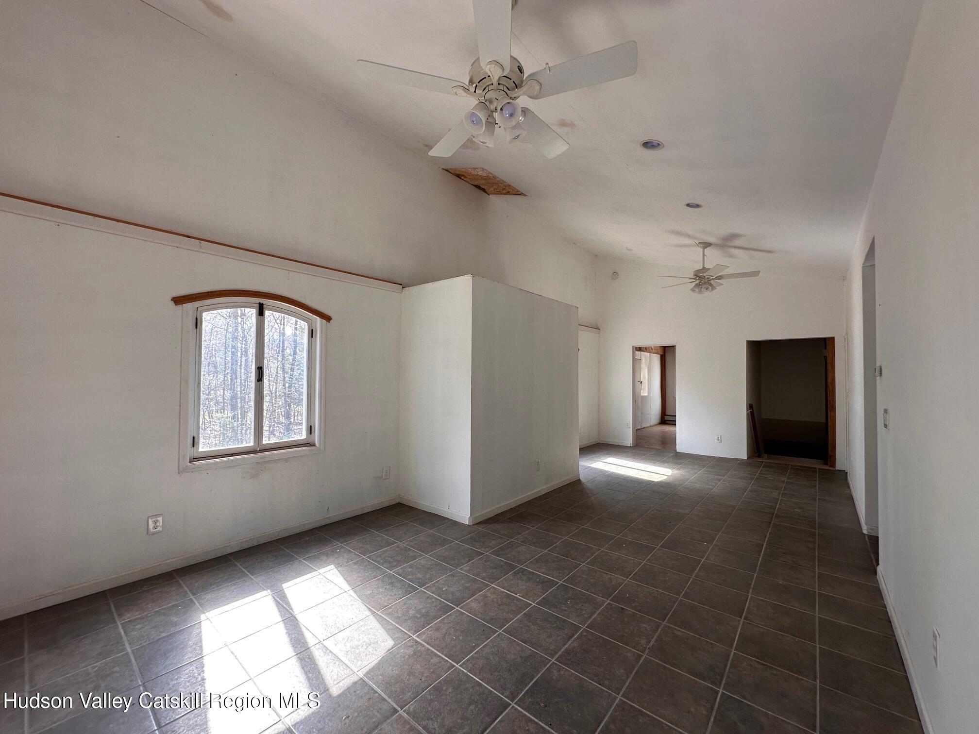 6 Riverbend Road Saugerties, NY 12477 - Photo 5 of 16 a view of empty room with window and fireplace