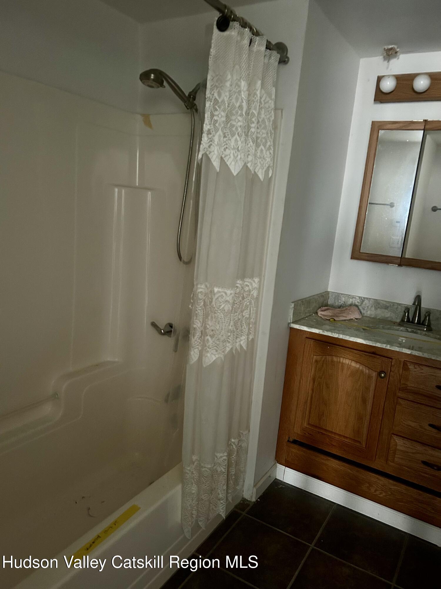6 Riverbend Road Saugerties, NY 12477 - Photo 9 of 16 a bathroom with a shower and a sink
