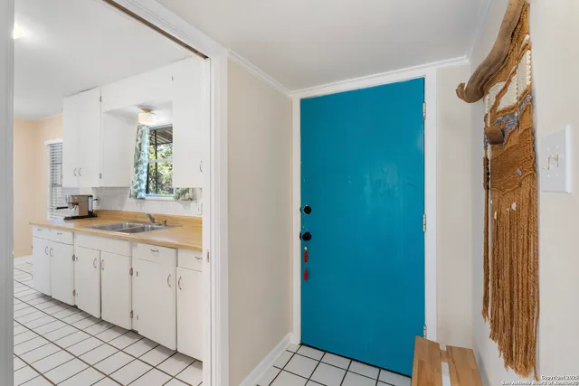 a spacious bathroom with a double vanity sink a mirror and a shower