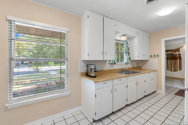 a view of a kitchen with a sink