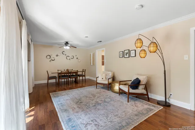 a living room with furniture and a table