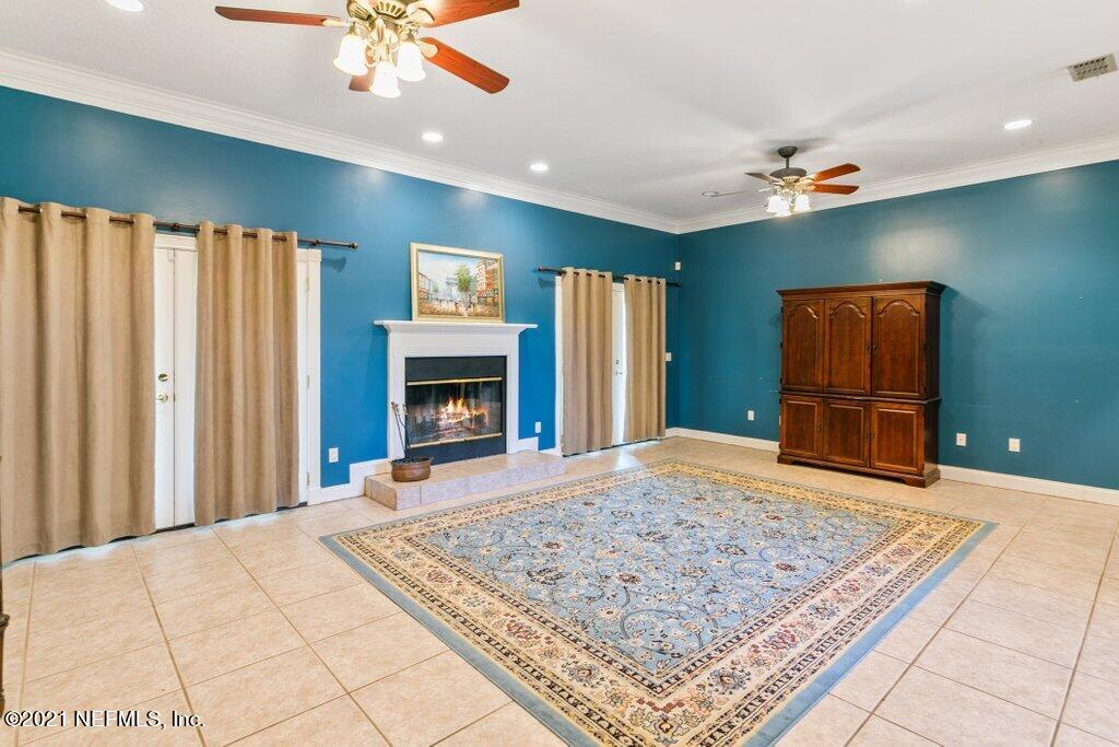 55268 Deer Run Road Callahan, FL 32011 - Photo 14 of 59 a view of an empty room with window and fireplace