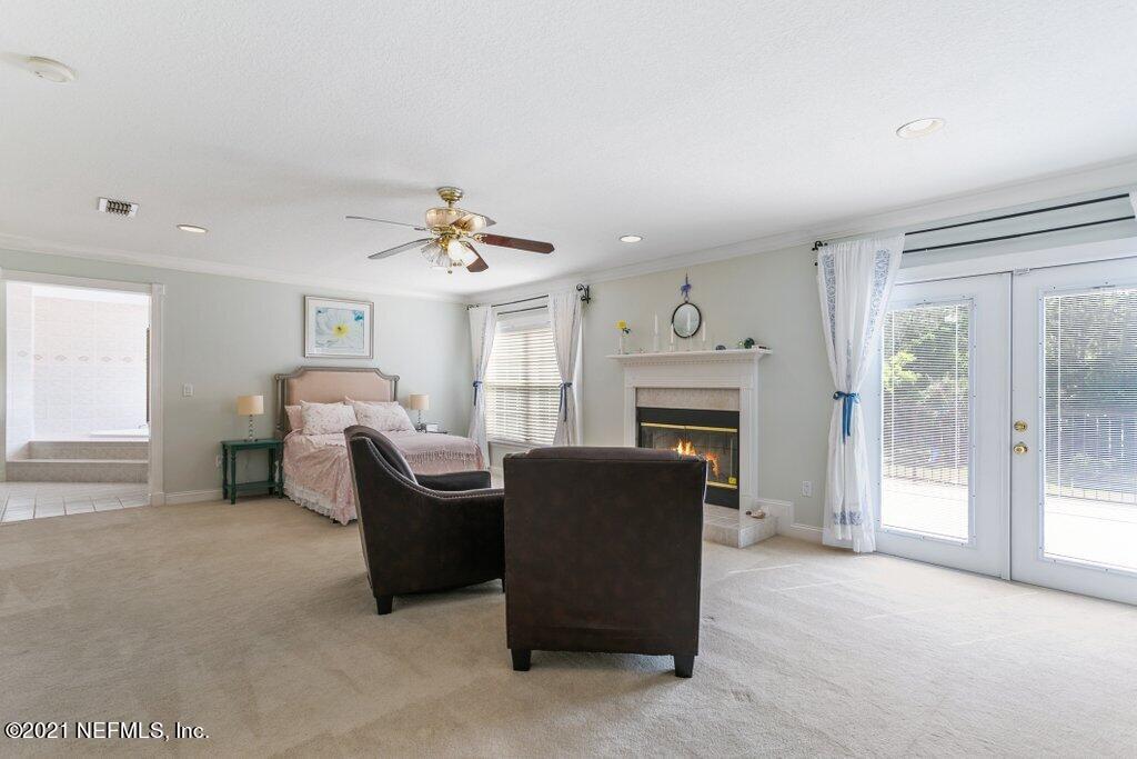 55268 Deer Run Road Callahan, FL 32011 - Photo 32 of 59 a living room with furniture and a fireplace