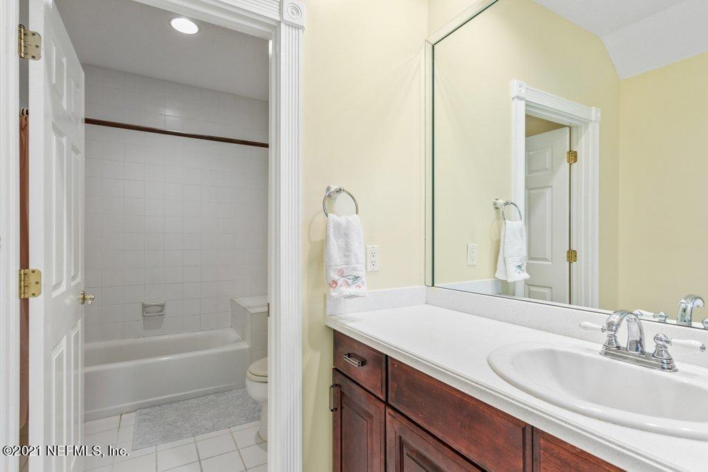 55268 Deer Run Road Callahan, FL 32011 - Photo 42 of 59 a bathroom with a tub sink and mirror