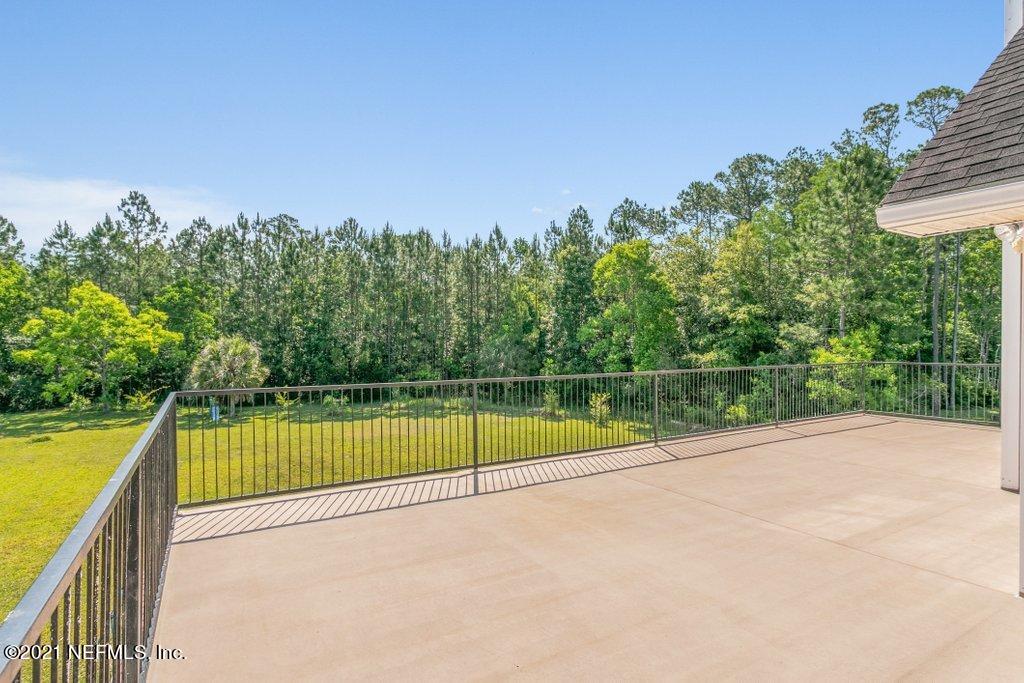 55268 Deer Run Road Callahan, FL 32011 - Photo 47 of 59 a view of a swimming pool with a patio