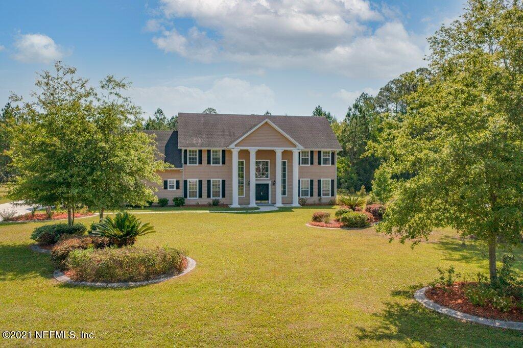55268 Deer Run Road Callahan, FL 32011 - Photo 51 of 59 a front view of a house with a yard