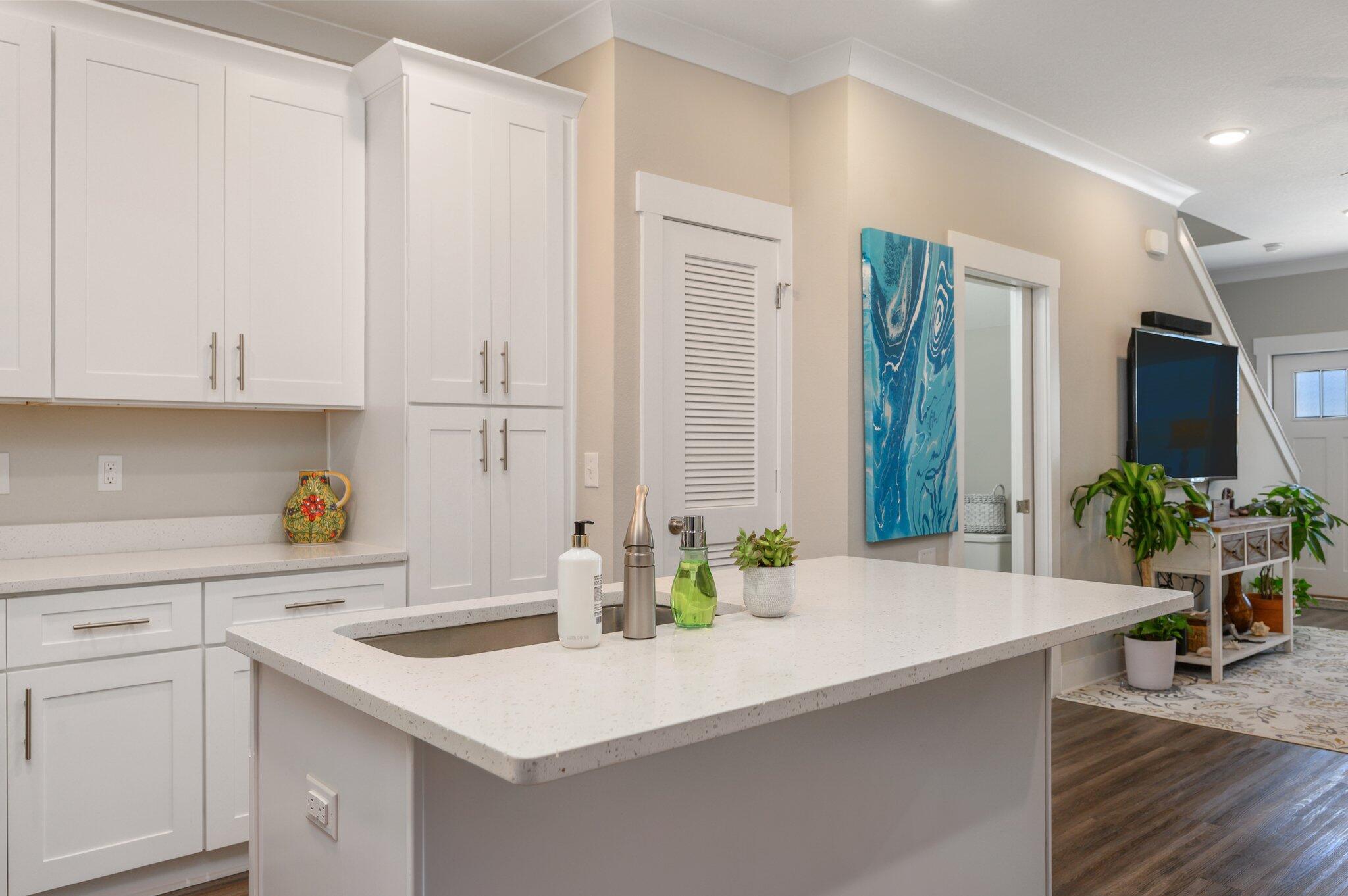 280 North Sand Palm Road Freeport, FL 32439 - Photo 11 of 34 a kitchen with a sink and cabinets