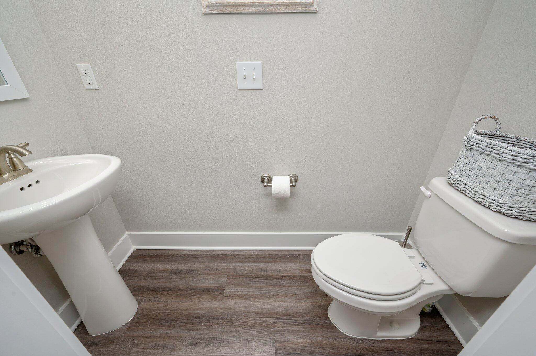 280 North Sand Palm Road Freeport, FL 32439 - Photo 13 of 34 a white toilet sitting next to a white sink