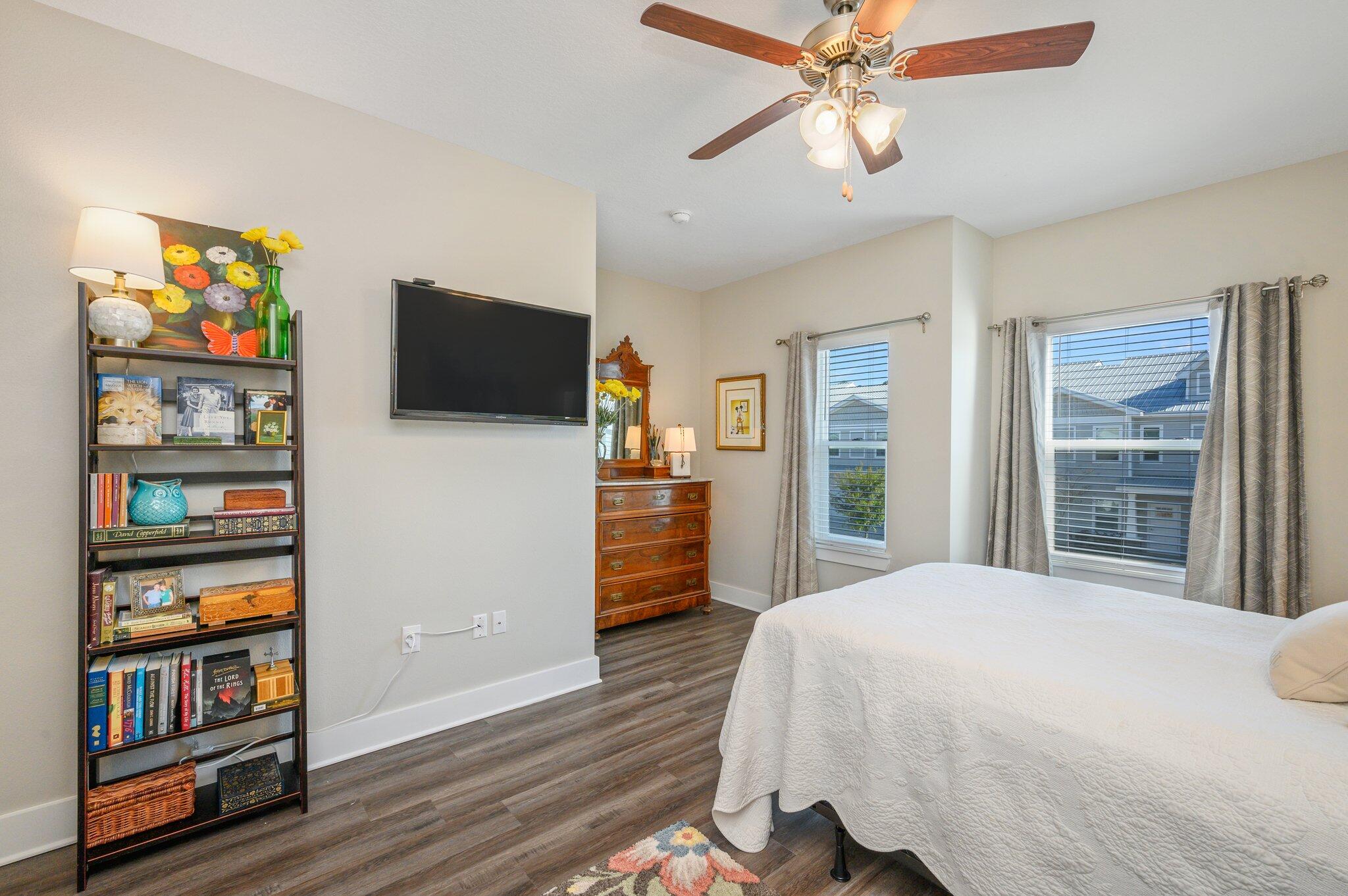 280 North Sand Palm Road Freeport, FL 32439 - Photo 18 of 34 a bedroom with a bed and a flat screen tv