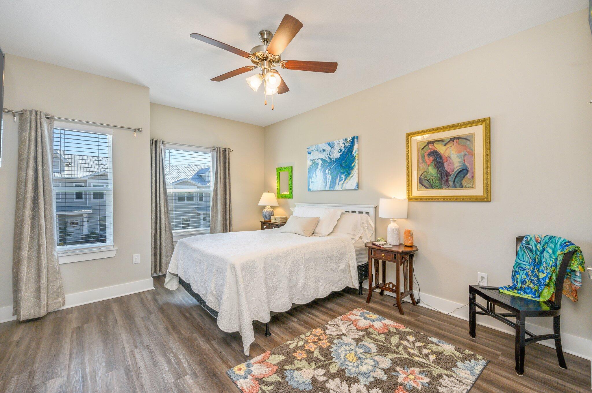 280 North Sand Palm Road Freeport, FL 32439 - Photo 19 of 34 a bedroom with a bed and a painting on the wall