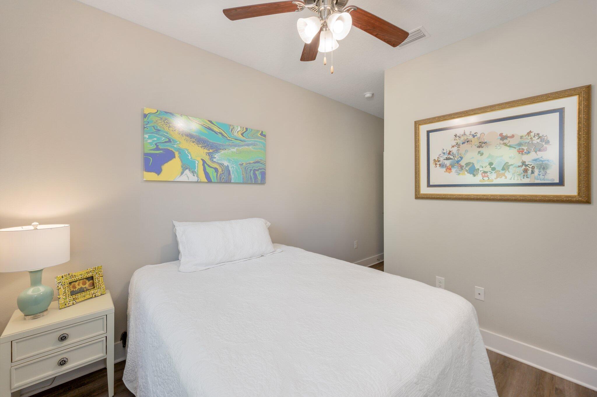 280 North Sand Palm Road Freeport, FL 32439 - Photo 25 of 34 a bedroom with a bed and a painting on the wall