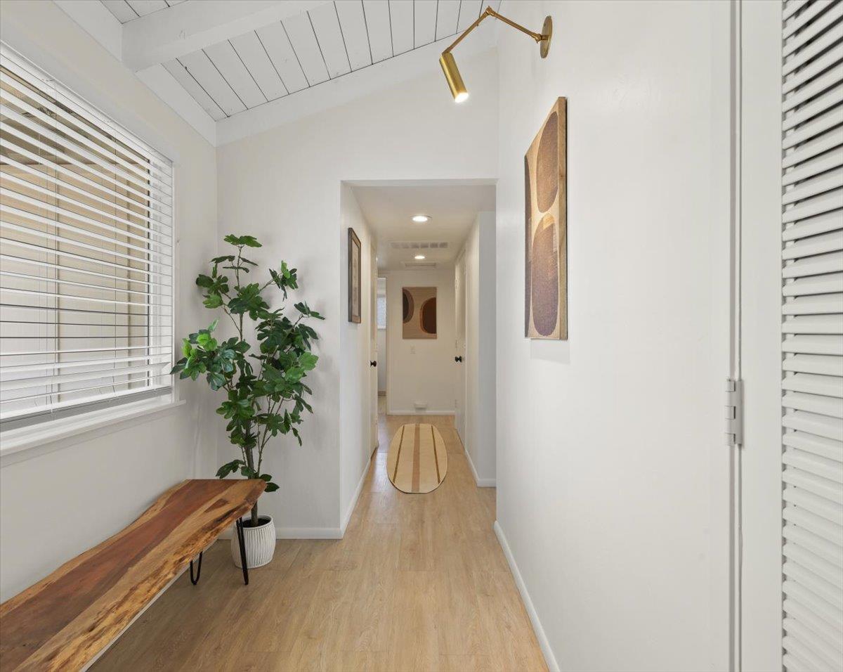 2715 Lafayette Street Soquel, CA 95073 - Photo 16 of 53 a hallway with a potted plant and a window