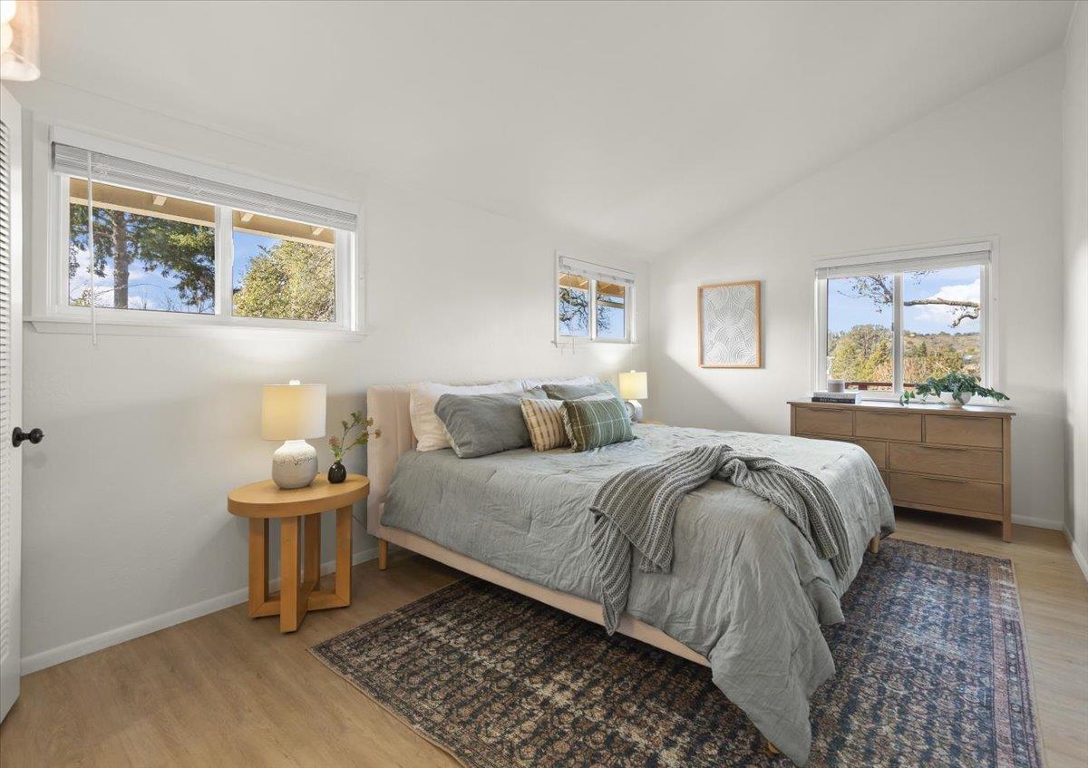 2715 Lafayette Street Soquel, CA 95073 - Photo 17 of 53 a bedroom with a bed and a lamp on dresser