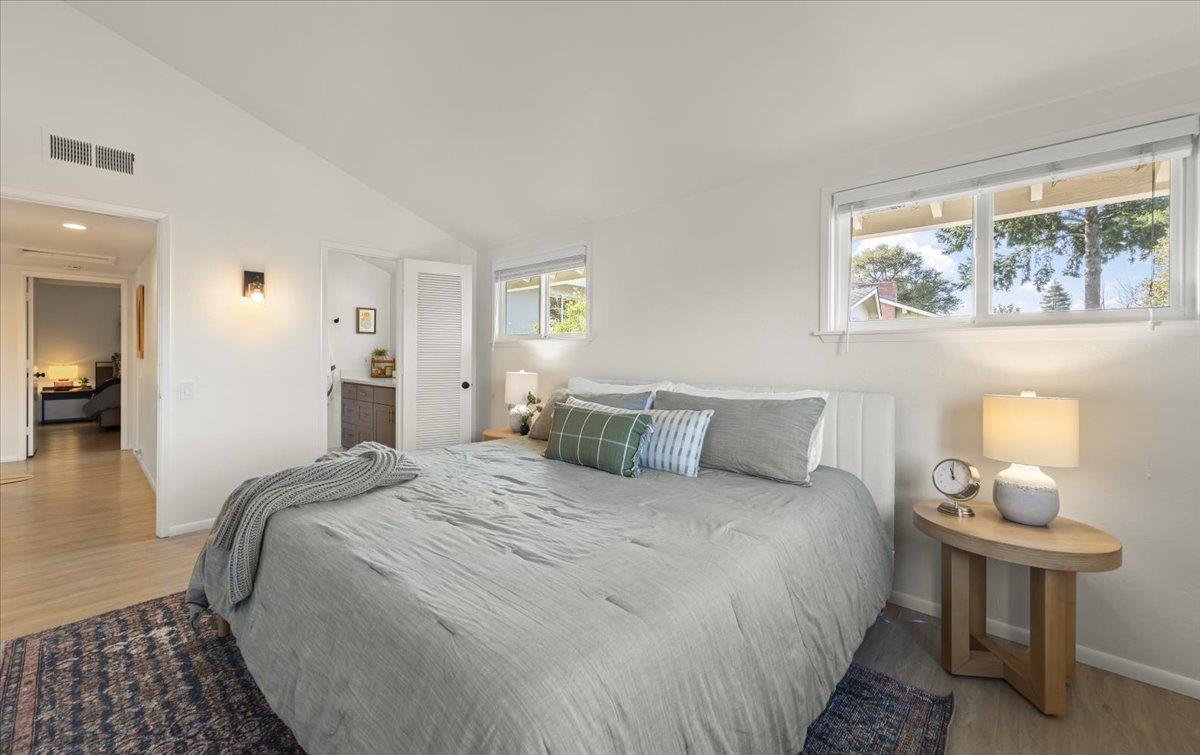 2715 Lafayette Street Soquel, CA 95073 - Photo 20 of 53 a bedroom with a bed and a lamp on table