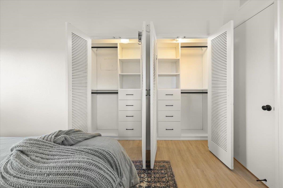 2715 Lafayette Street Soquel, CA 95073 - Photo 22 of 53 a bedroom with a bed and wooden floor