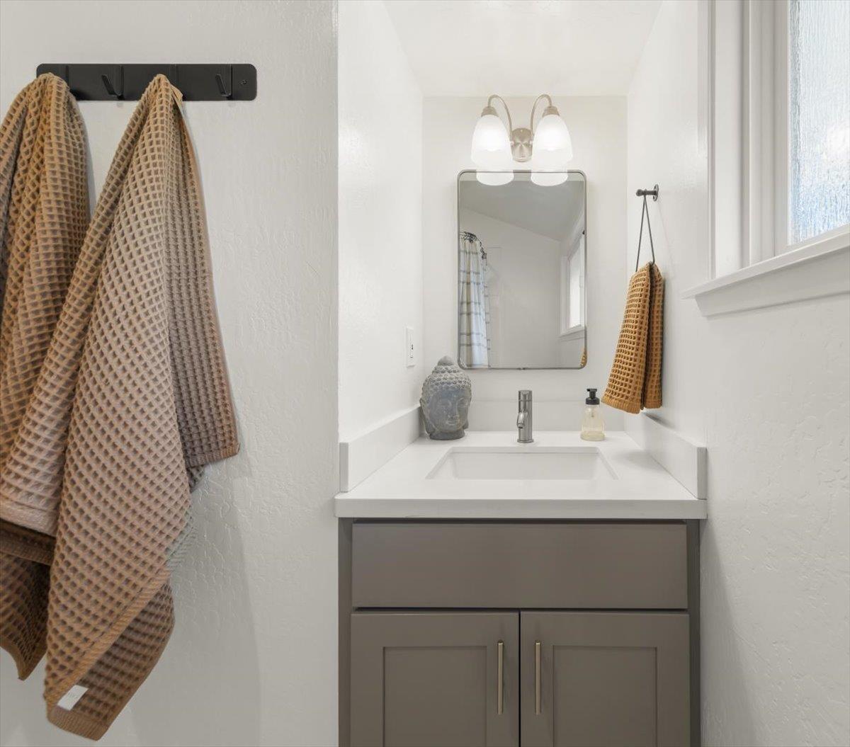 2715 Lafayette Street Soquel, CA 95073 - Photo 29 of 53 a bathroom with a sink vanity and a mirror