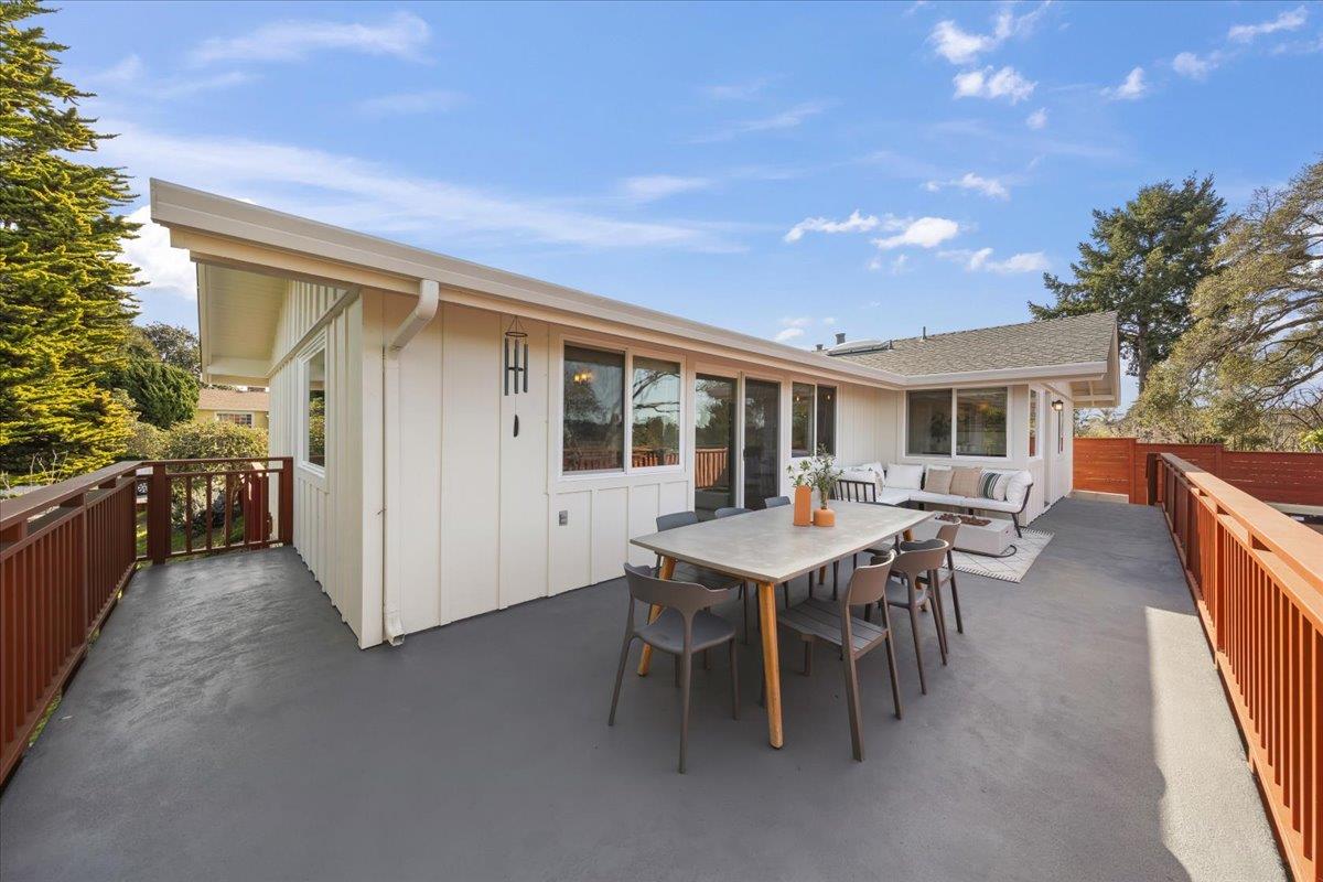 2715 Lafayette Street Soquel, CA 95073 - Photo 36 of 53 a view of a patio with table and chairs and wooden fence