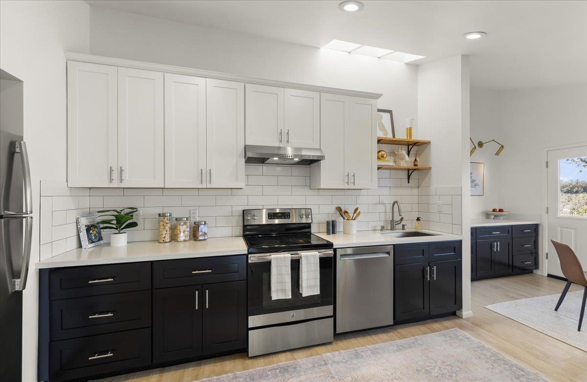 2715 Lafayette Street Soquel, CA 95073 - Photo 4 of 53 a kitchen with stainless steel appliances granite countertop a stove a sink and a refrigerator