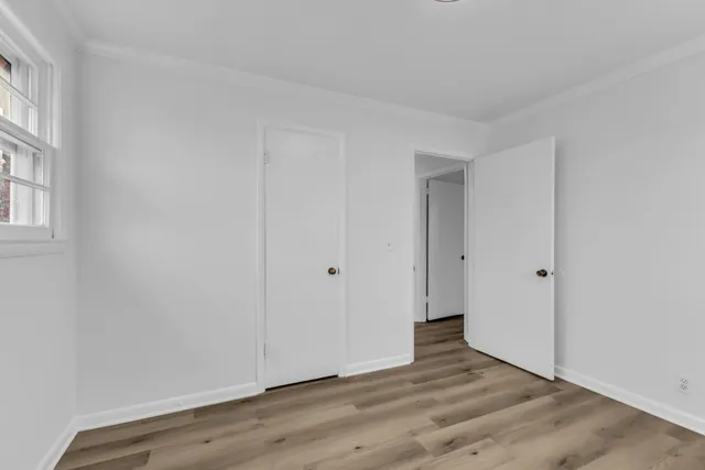 an empty room with a hardwood