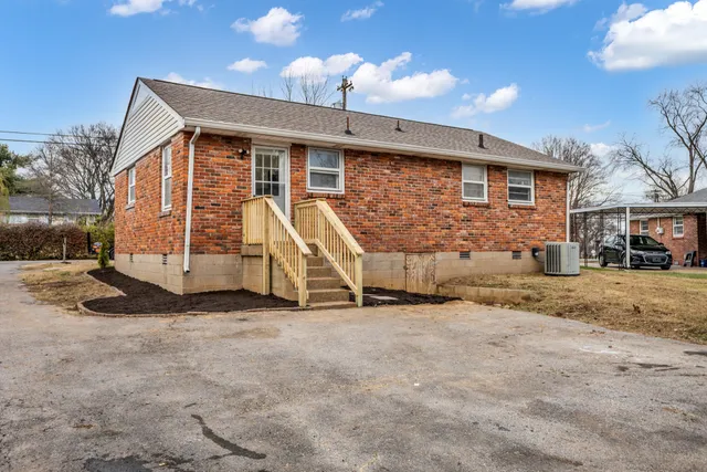 a view of large house with a yard
